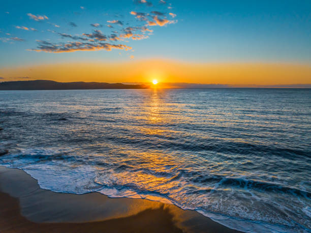 istock Aerial sunrise views over the ocean and beach 2064327645