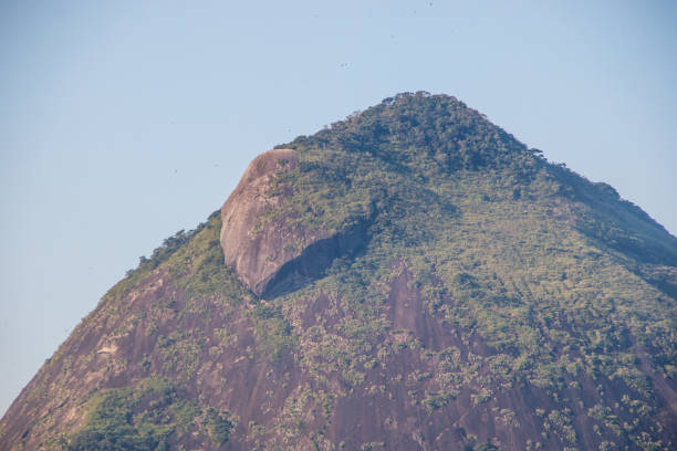 Maroca Stone (Morro dos Cabritos) seen from Rodrigo de Freitas Lagoon, in Rio de Janeiro, Brazil.
