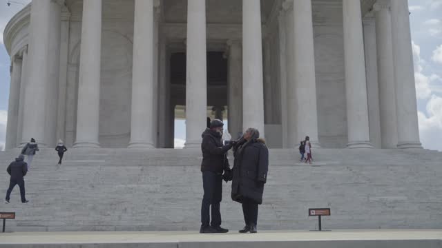 Black senior couple visiting the Jefferson Memorial in winter