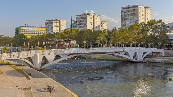 Skopje, North Macedonia - October 23, 2023: Bridge of Civilisations Over River Vardar in Capital City Centre at Autumn Day.