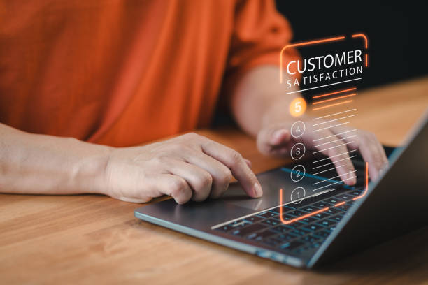 istock Customer experience concept, best excellent services rating by online application, customer using a laptop give ratings 5 point for feedback review satisfaction service opinion and testimonial. 2064410092