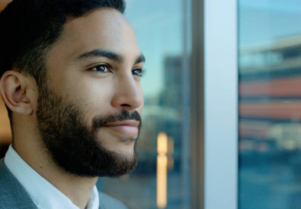 istock Business, man and thinking by window in office for corporate inspiration, project ideas or smile. Professional, employee and thoughtful or daydreaming at workplace for career opportunity with closeup 2064414563