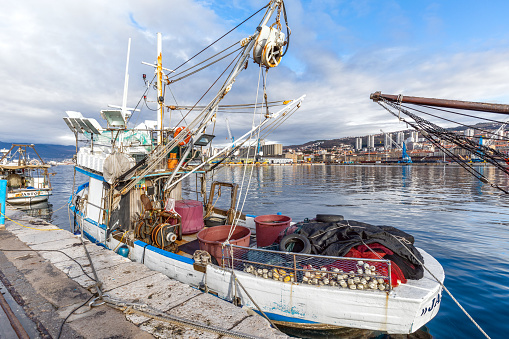 Rijeka, Croatia - March 2, 2024: Fishing boat tied up in the port of Rijeka