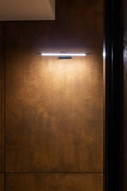 istock Spot light hanging on wooden wall 2064459405