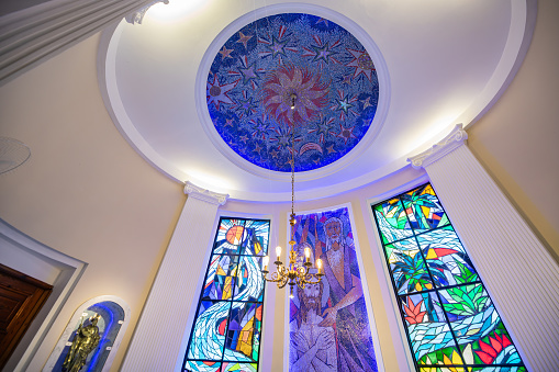 Interior of the Parish São Judas Tadeu church in Rio de Janerio, Brazil with sained glass windows