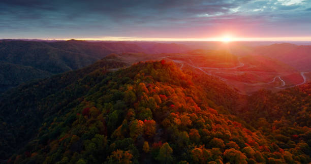 Aerial shot of scenery in Raleigh County, West Virginia during a dramatic sunset on an overcast evening in Fall.