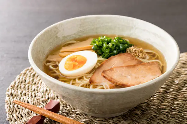 A photo of ramen with steam rising and a sizzling sensation