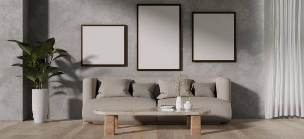 istock A contemporary living room features a grey couch, a coffee table, and frames mockup on a loft wall. 2064549896