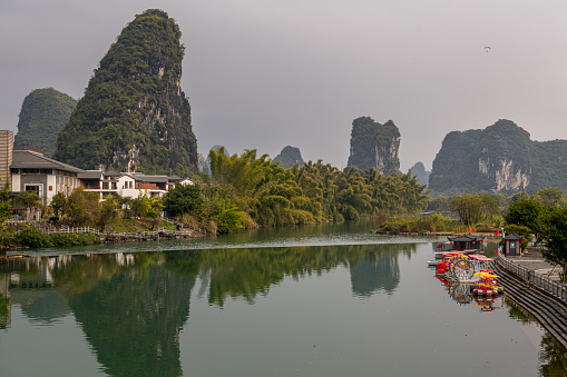 Landscape of Guilin, rural areas. Karst mountains, farmland and small villages. Located near Yangshuo, Guilin, Guangxi, China.