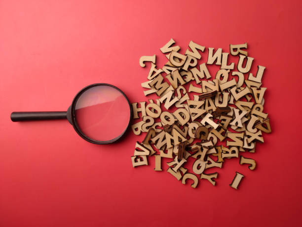 istock Top view wooden word and black magnifying glass 2064599481