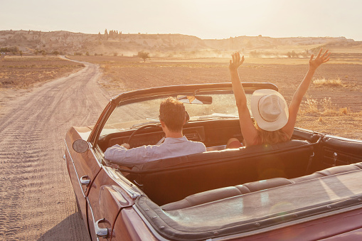 happy couple travel in vintage classic car, summer holidays