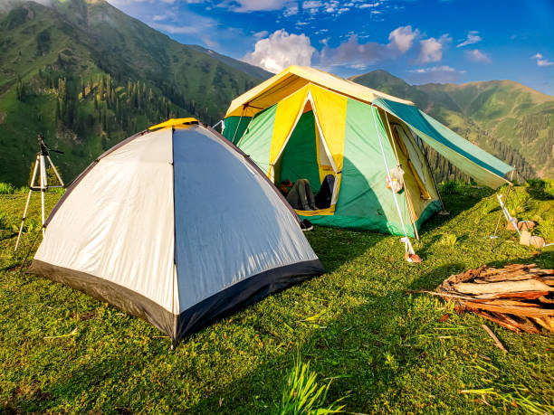 istock Tourists camping tents over the green mountain. Camping scenery 2064664714