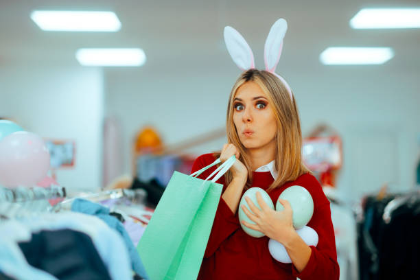 Shopping Woman Enjoying Easter Sale Season in a Store Excited lady celebrating spring holidays enjoying the sales spokesmodel stock pictures, royalty-free photos & images