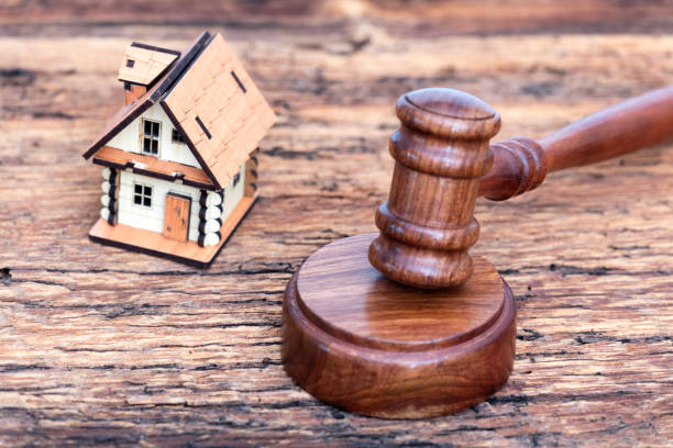 istock Model house and gavel on the table 2064828582