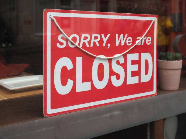 istock sorry closed sign in shop window 2064892899