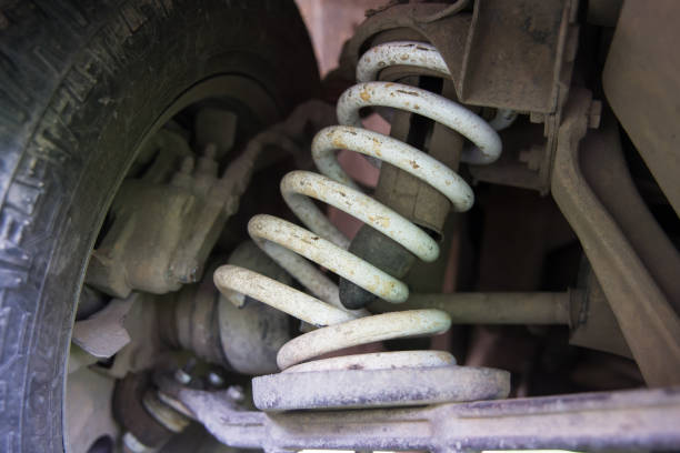 broken spring. Car suspension with a broken spring. broken spring stock pictures, royalty-free photos & images