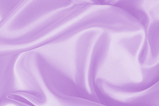 Light purple fabric texture background, detail of silk or linen pattern.