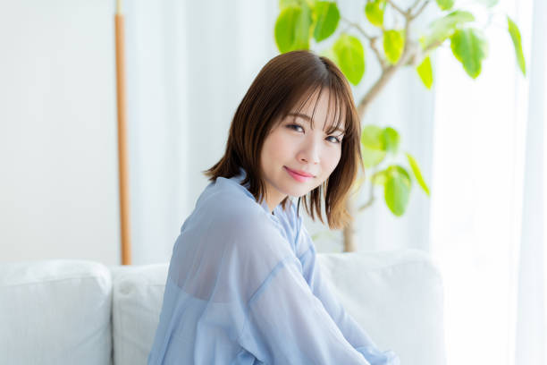 istock young woman relaxing on the sofa 2064974842