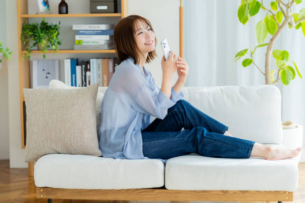 istock young woman with mobile phone 2064979629