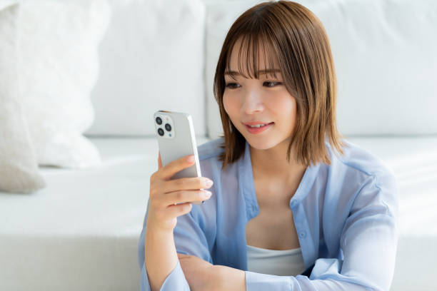 istock young woman with mobile phone 2064985294