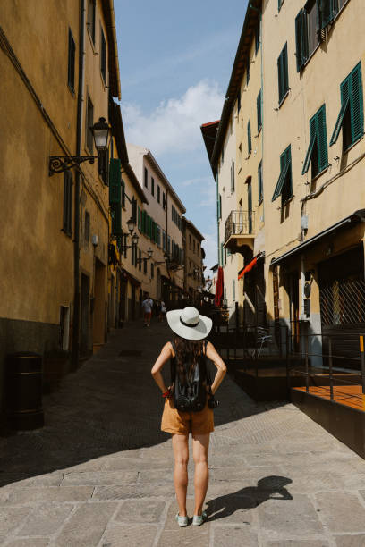 istock female tourist visiting Siena, Italy 2064991559