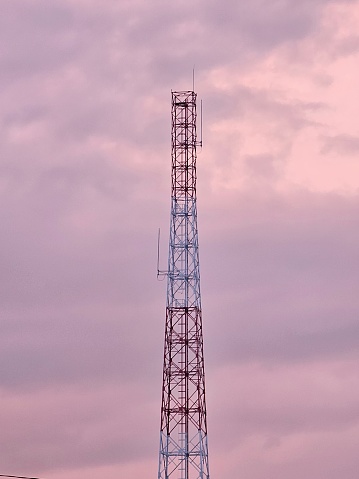 Network tower looks beautiful against the red sky of the afternoon