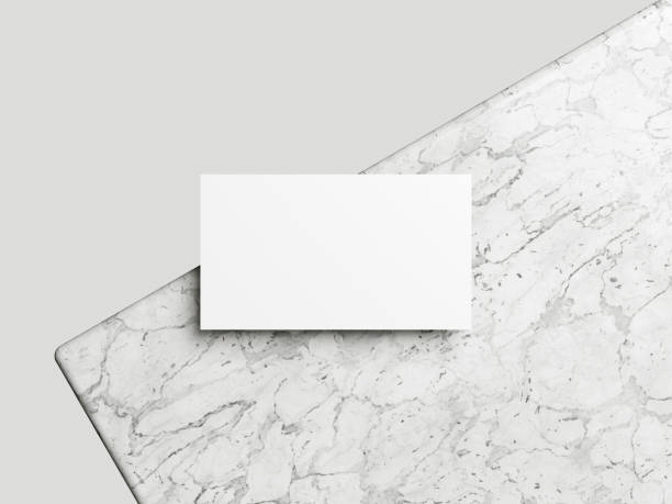 istock Business card on white marble background 2065058549