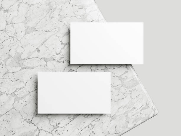 istock Business card on white marble background 2065058556