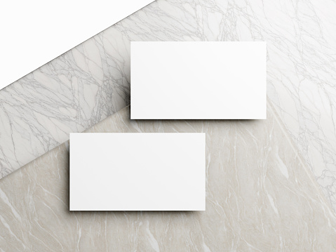 Business card on white marble background