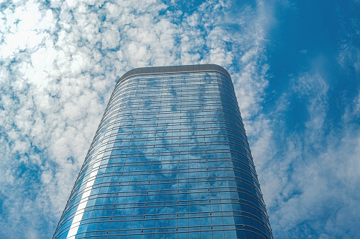 a modern office tower building or apartment with copy space during the day