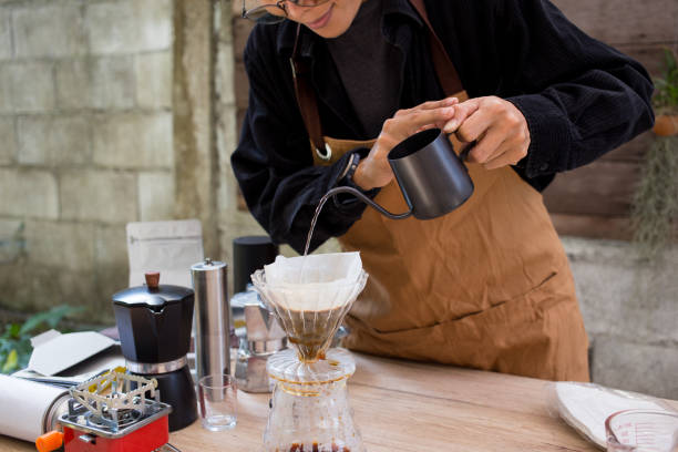 istock people making coffee for dripping hot coffee into the cup with equipment, tool brewing on slow bar 2065117661