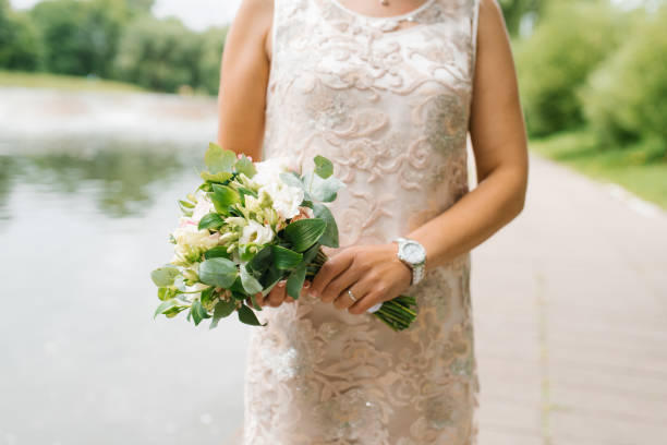 istock Beautiful rustic wedding bouquet in the hands of the bride 2065127635