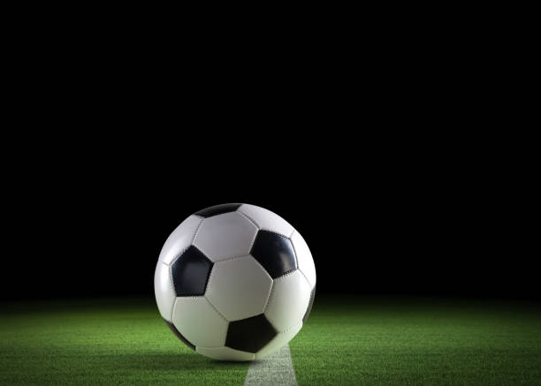 istock Football ball on the stadium grass 2065146179