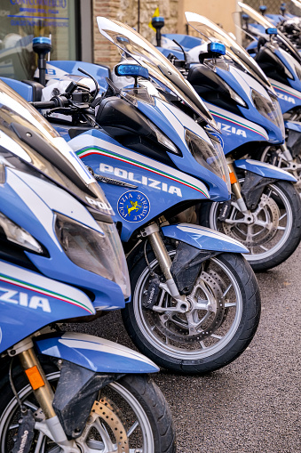 Italy, March 6 -- Some motorcycles of the Highway Patrol of the Italian State Police parked along a street in Italy. Image in high definition quality.