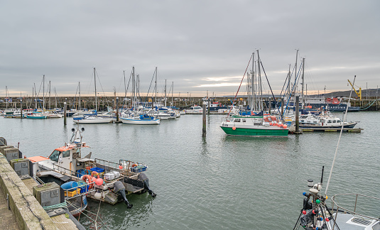 Commercial and Pleasure boats moored in Scarborough Harbour, Yorkshire, England