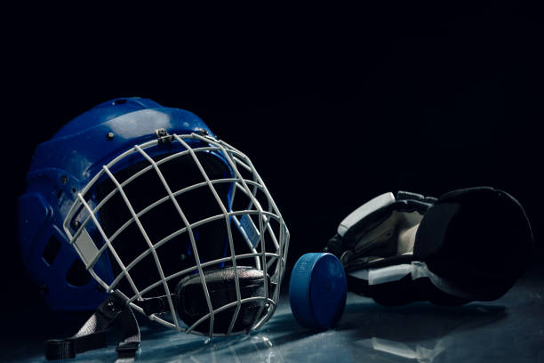 istock Ice hockey gear on  the ice rink. 2065173560