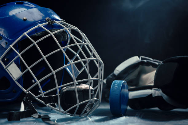 istock Ice hockey gear on  the ice rink. 2065173570