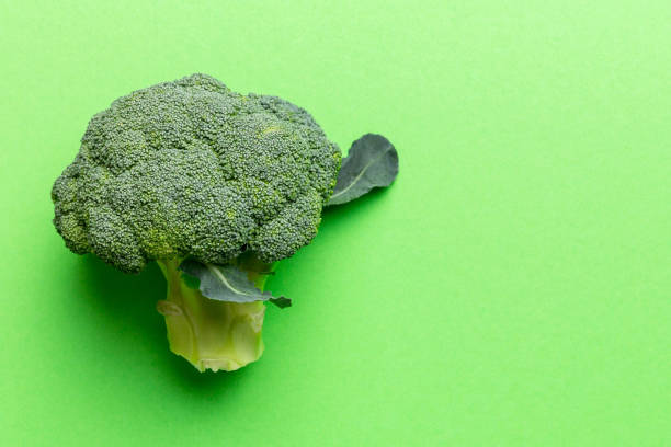 istock Top view fresh green broccoli vegetable on Colored background. Broccoli cabbage head Healthy or vegetarian food concept. Flat lay. Copy space 2065177289