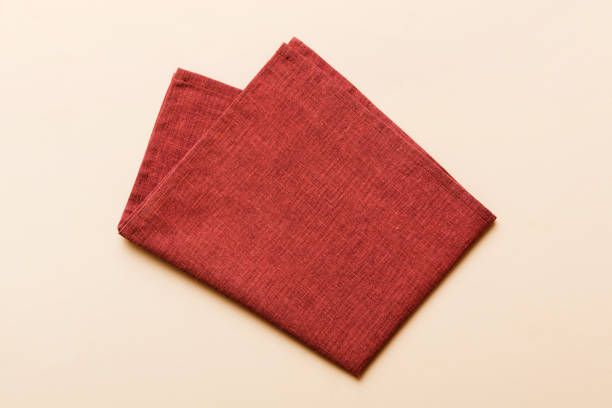 istock top view with red empty kitchen napkin isolated on table background. Folded cloth for mockup with copy space, Flat lay. Minimal style 2065177869