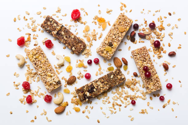 istock Various granola bars on table background. Cereal granola bars. Superfood breakfast bars with oats, nuts and berries, close up. Superfood concept 2065178410