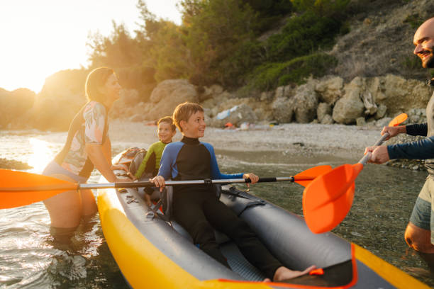 istock Family exploring the wild beach by kayak 2065181067