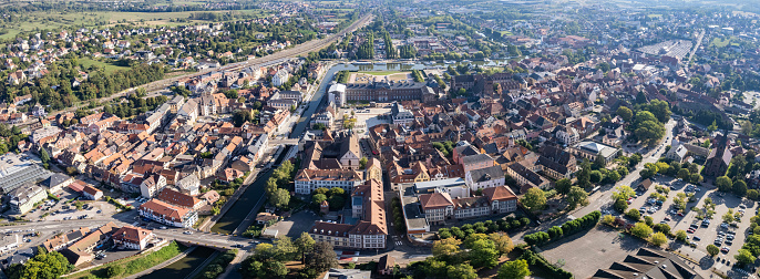 Aerial around the old town of Saverne on a sunny day on a late afternoon in early spring.