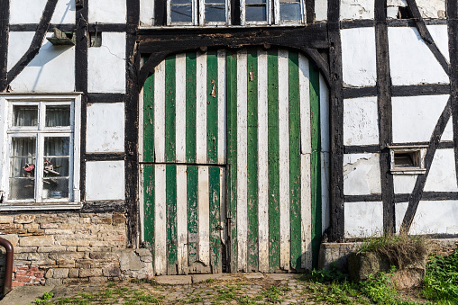 Striped gate in an old German half-timbered farmhouse