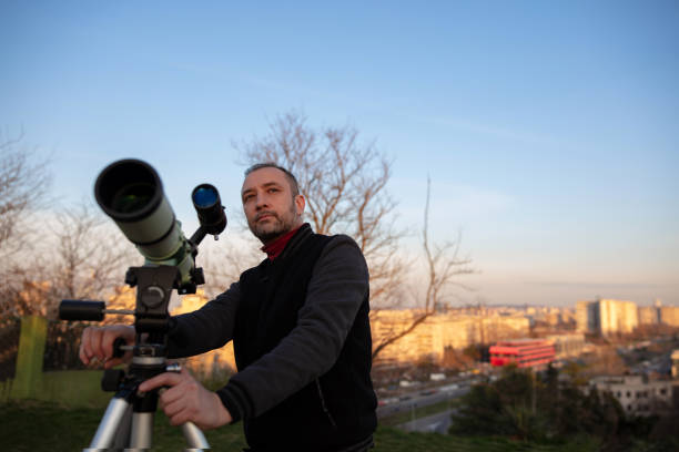 istock Amateur astronomer observing Sun eclipse and Sun with a telescope and special solar filter. 2065199420