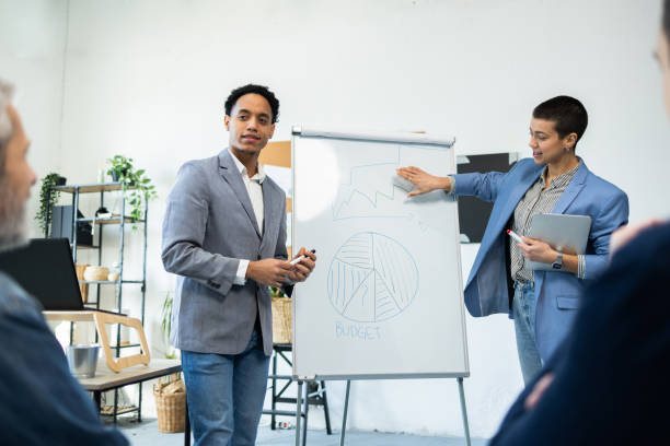 istock Two members of a business team presenting the new project 2065201487