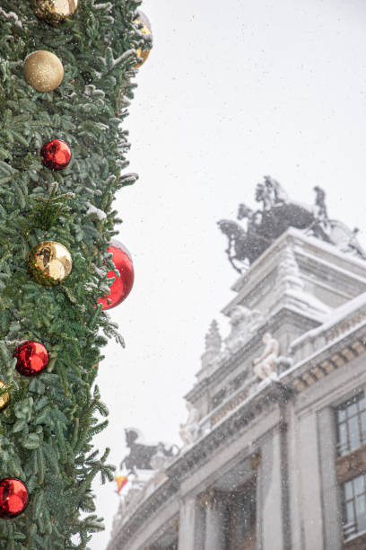 istock Snowy christmas tree decorated with gold and red Christmas baubles 2065201682