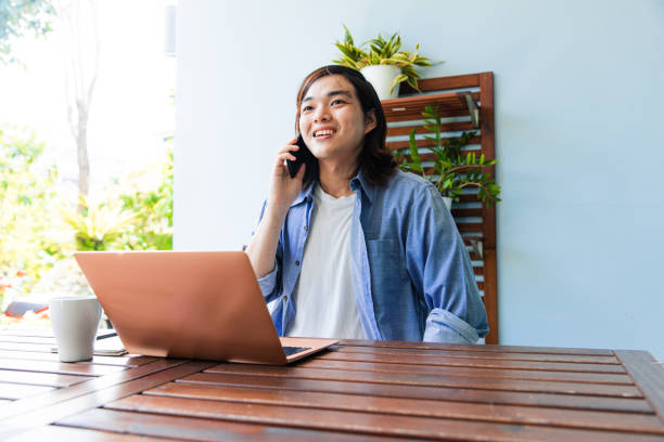 istock Young man working outdoor. Talking on phone. 2065213214