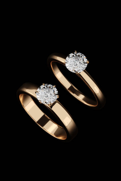 istock Two diamond rings on a black background. Designed with 3D renderings, close-up top view. 2065224832