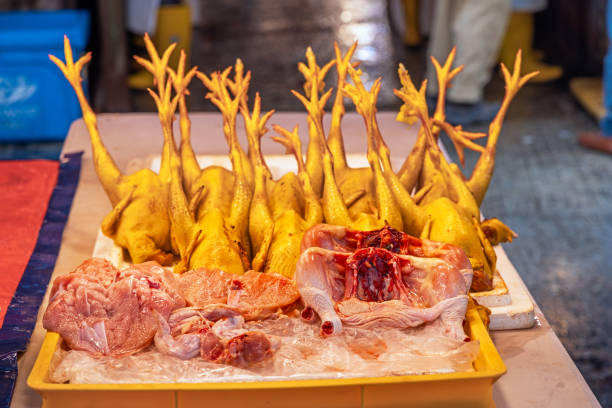 Fresh slaughtered chicken put up for sale at a market stall in the central Chow Kit market in the center of the Malaysian capital Kuala Lumpur
