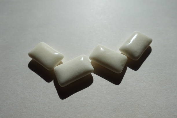 istock Closeup of four white rectangular pieces of chewing gum 2065285041